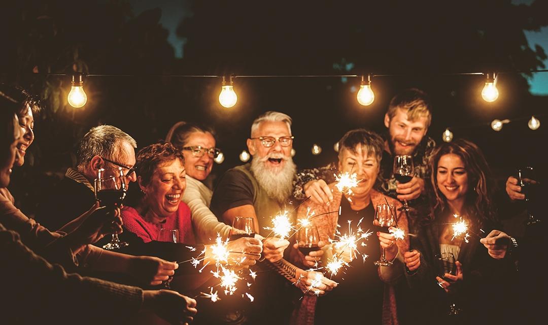 Article Cards Featured Image Happy family celebrating with sparklers fireworks at night party   Group of people with different ages and ethnicity having fun together   Holidays lifestyle concept