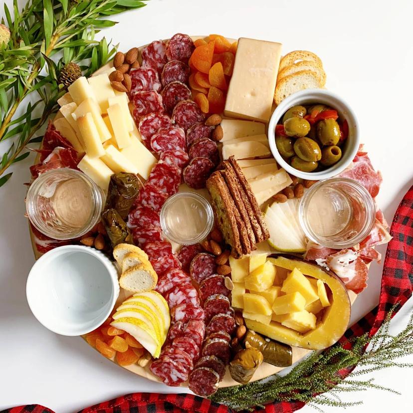 Adding bread and crackers to a cheese board