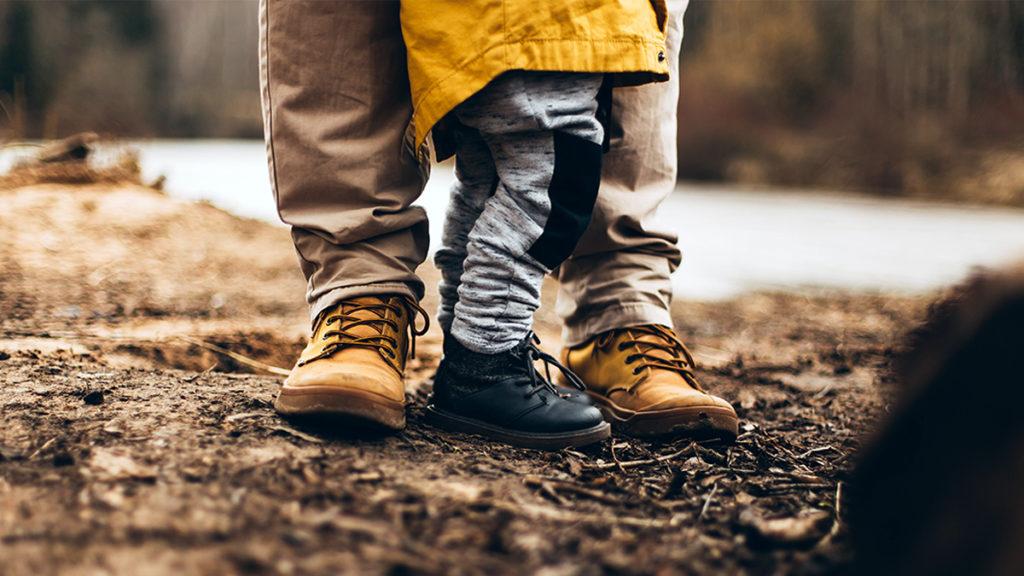 This is an image of Father's Day ideas. Legs of father and son.