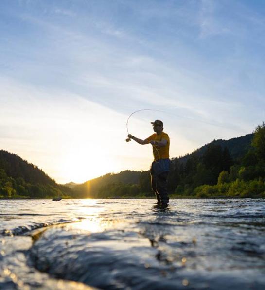 Last minute Father's Day gift ideas with someone fishing in a river.