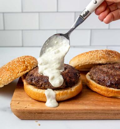 smokey blue cheese sauce on wagyu beef burgers