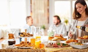 history of brunch    woman pouring champagne image