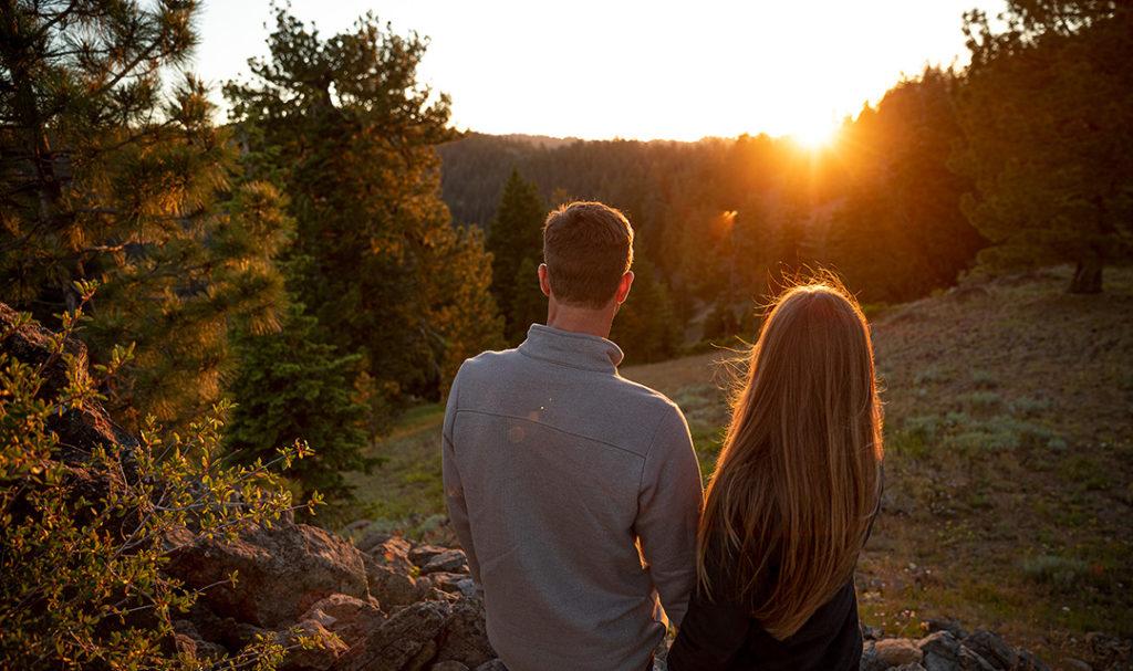 mindful vacation    couple looking at sunset