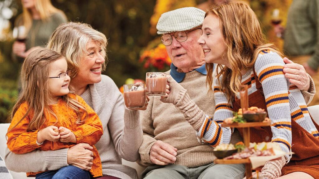 Grandparents day image   grandparents and grandchildren drinking hot chocolate outside