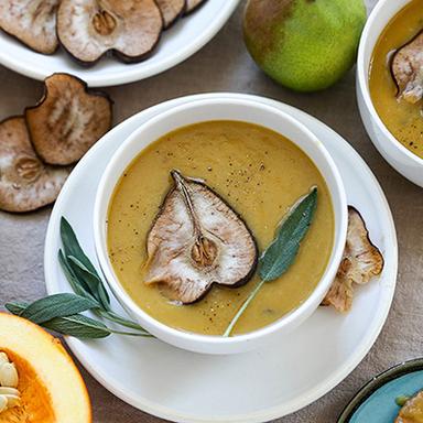 Pumpkin pear soup in a bowl.