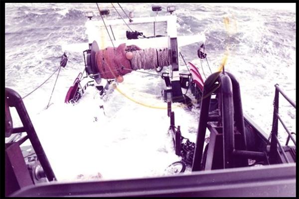 A photo of vital choice with a boat in a a rough ocean.