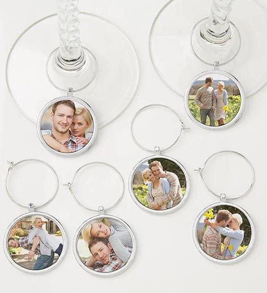 A photo of wine gifts for mom with several personalized wine stem charms with photos of a married couple