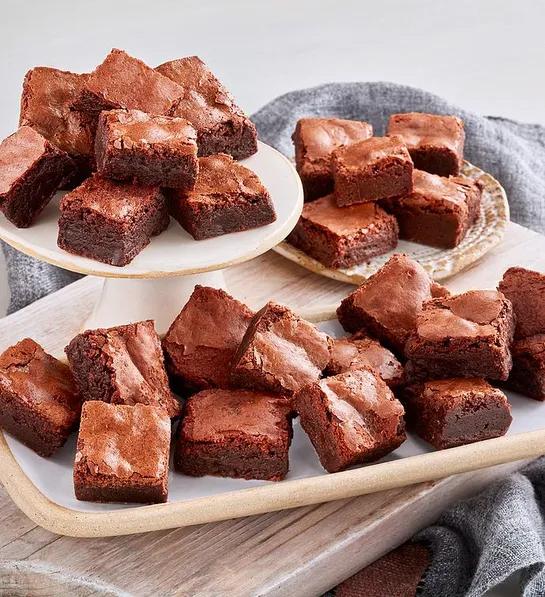 Gluten free cakes with a plate of chocolate brownies.