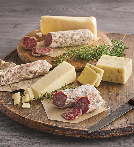 Mother in law gifts with a wooden cutting board full of cheese and charcuterie.