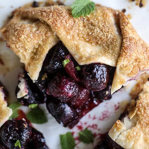 Types of cake with a closeup of a slice of cherry galette.