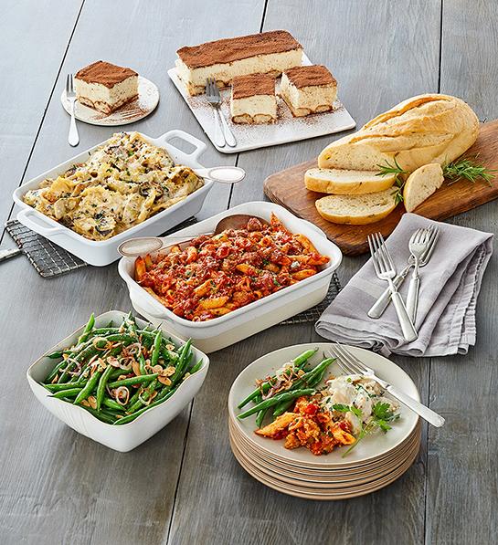 Gifts for the home cook with a table carrying multiple Italian dishes.