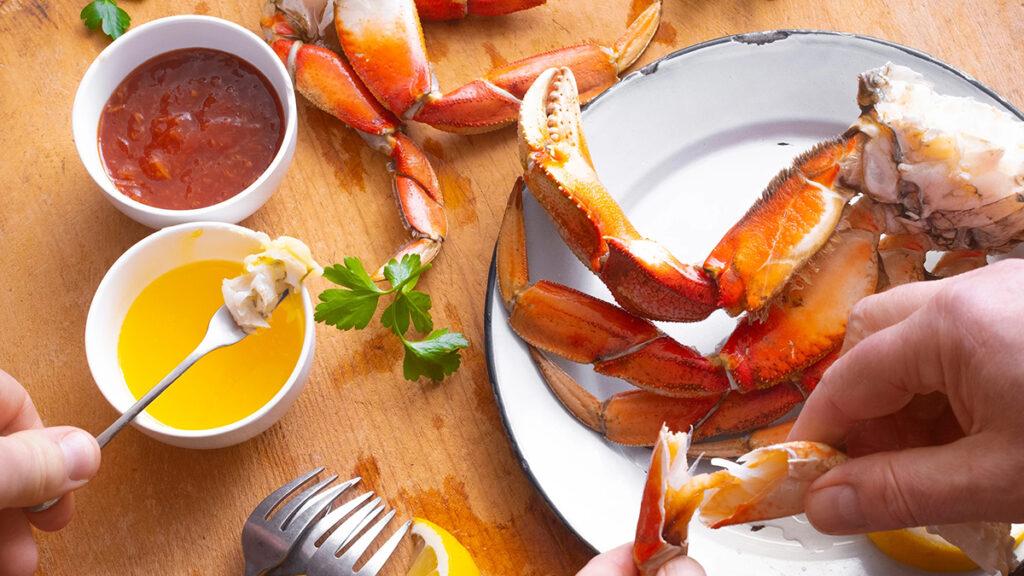 Seafood and vegetable pairings with a plate of crab and dip.